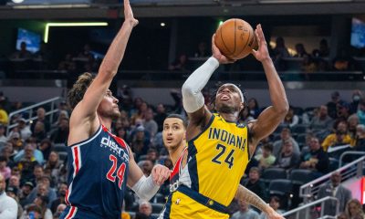 Dec 9, 2022; Indianapolis, Indiana, USA; Indiana Pacers guard Buddy Hield (24) shoots the ball while Washington Wizards forward Corey Kispert (24) defends in the second quarter at Gainbridge Fieldhouse. Mandatory Credit: Trevor Ruszkowski-USA TODAY Sports