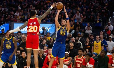 Jan 2, 2023; San Francisco, California, USA; Golden State Warriors guard Klay Thompson (11) shoots over Atlanta Hawks forward John Collins (20) during the first overtime at Chase Center. Mandatory Credit: D. Ross Cameron-USA TODAY Sports